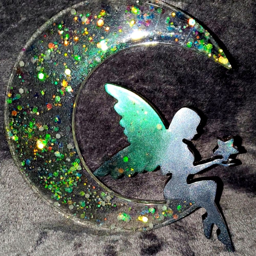 Resin fairy sitting on moon